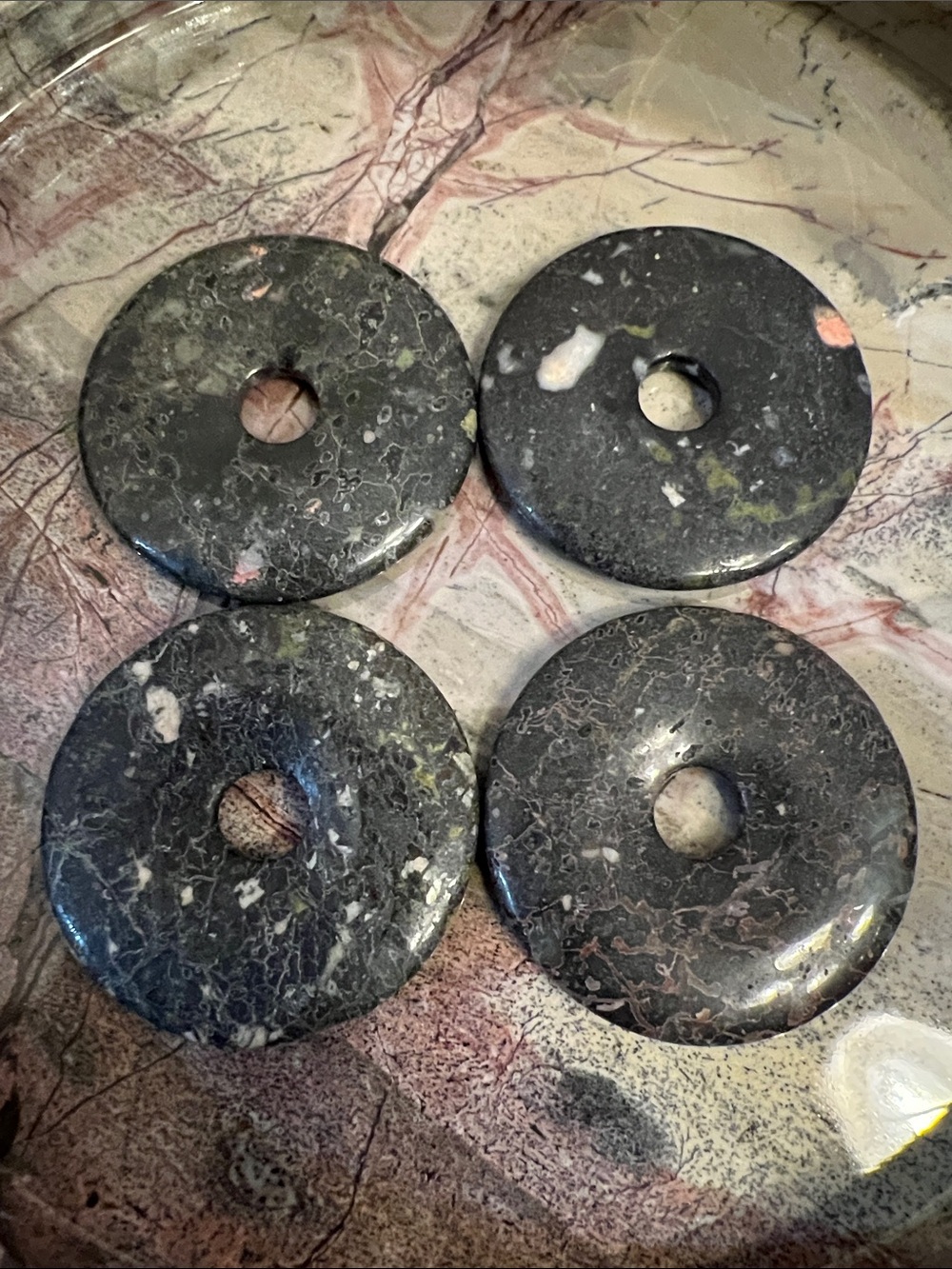 Natural stone sphere stands, dark gray, lot of 4